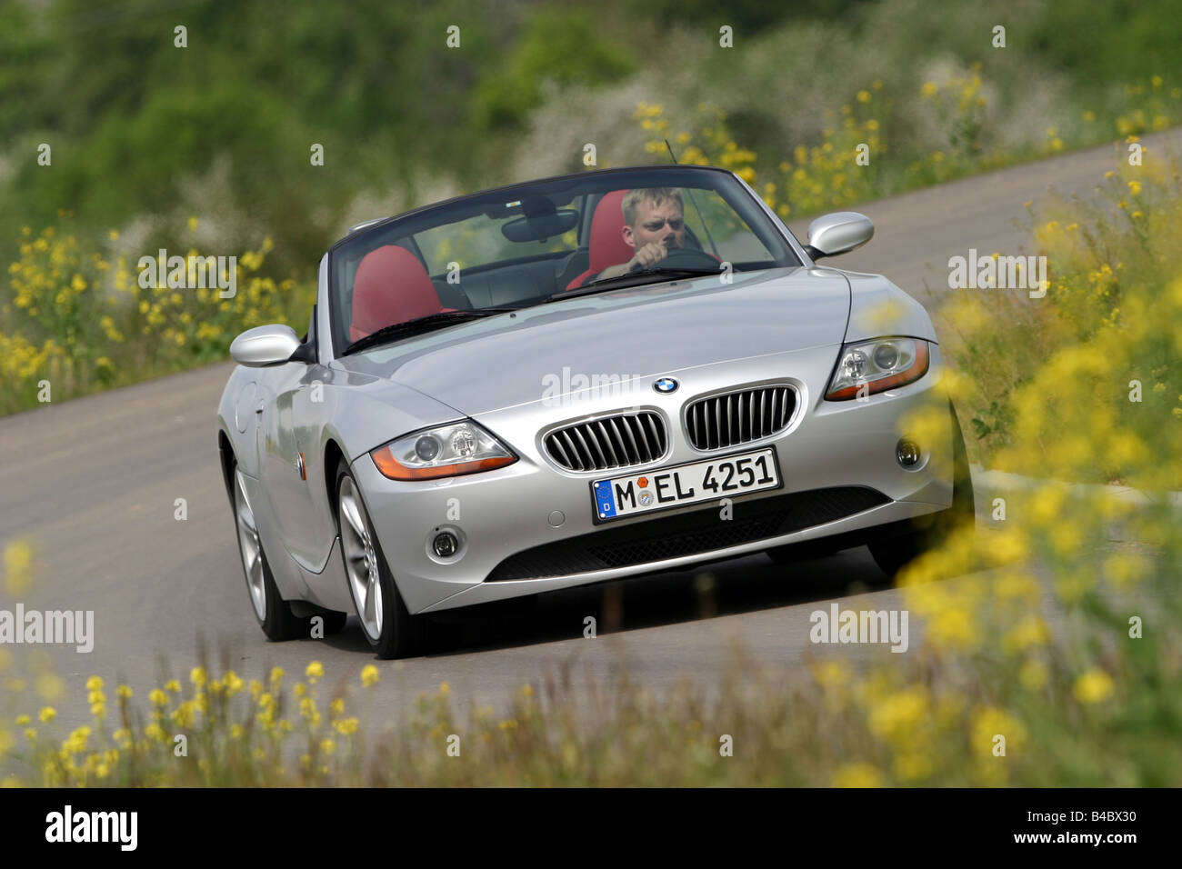 Car, BMW Z4 3.0i, Convertible, model year 2002-, silver, open top, driving,  diagonal from the front, frontal view, country road Stock Photo - Alamy