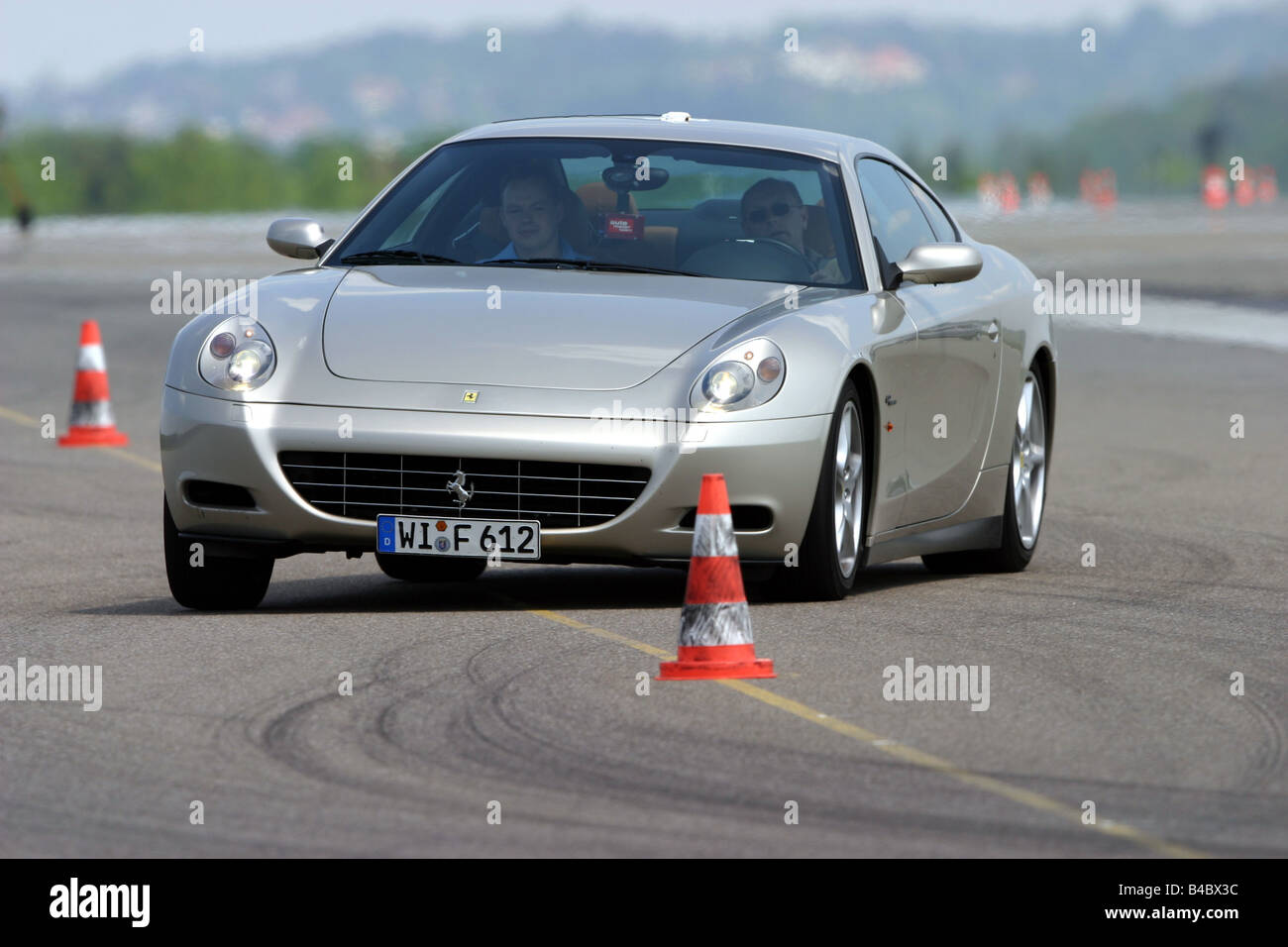 Car, Ferrari 612 Sapprox.lietti, roadster, model year 2004-, silver, coupe/Coupe, driving, diagonal from the front, frontal view Stock Photo