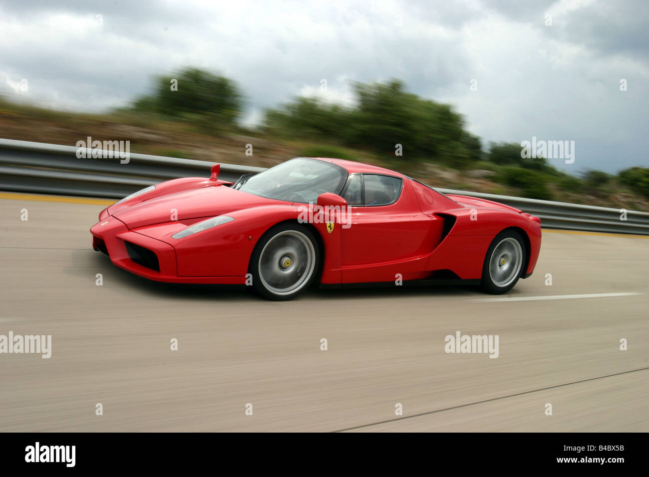 Car, Ferrari Enzo Ferrari, roadster, model year 2002-, Coupe/coupe, red, driving, diagonal from the front, side view, test track Stock Photo