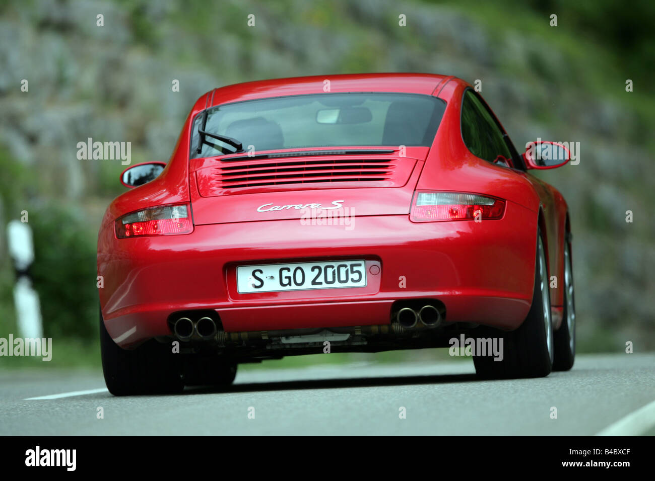 Car, Porsche 911 Carrera S, roadster, model year 2004-, coupe/Coupe, red,  driving, diagonal from the back, rear view, country ro Stock Photo - Alamy