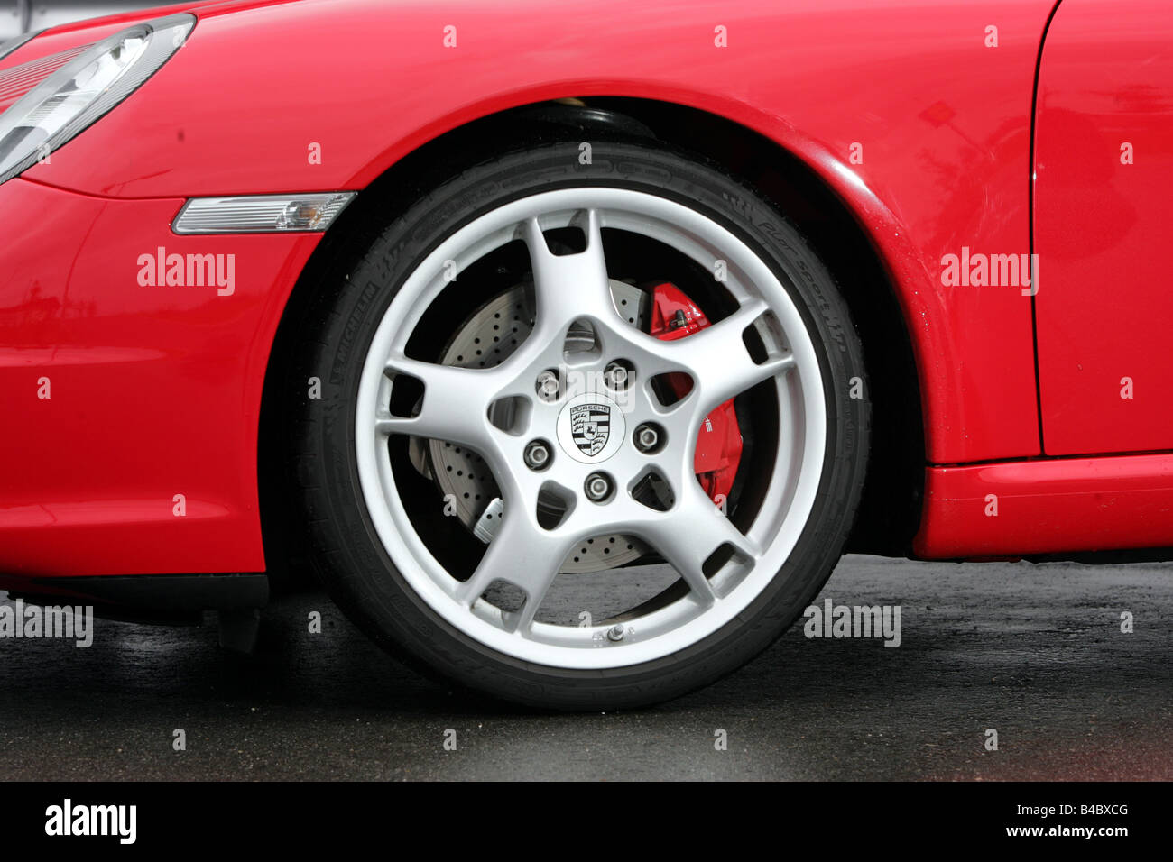 Car, Porsche 911 Carrera S, roadster, model year 2004-, coupe/Coupe, red, Detailed view, Front tyres, Front wheel, technique/acc Stock Photo
