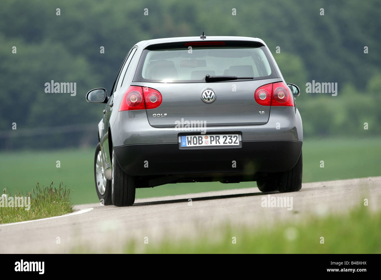 Car, VW Volkswagen Golf 1.6 Trendline, Limousine, Lower middle-sized class,  anthracite, model year 2004-, driving, diagonal from Stock Photo - Alamy