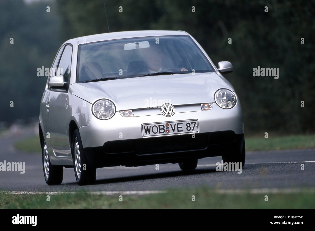 Car, VW Volkswagen Lupo, 3-liter approx., model year 2004, silver, Minicars, driving, diagonal from the front, country road, fro Stock Photo