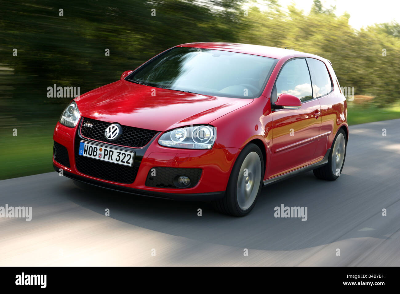 Car, VW Volkswagen Golf GTI, Golf V, model year 2004-, red, Limousine,  Lower middle-sized class, driving, diagonal from the fron Stock Photo -  Alamy