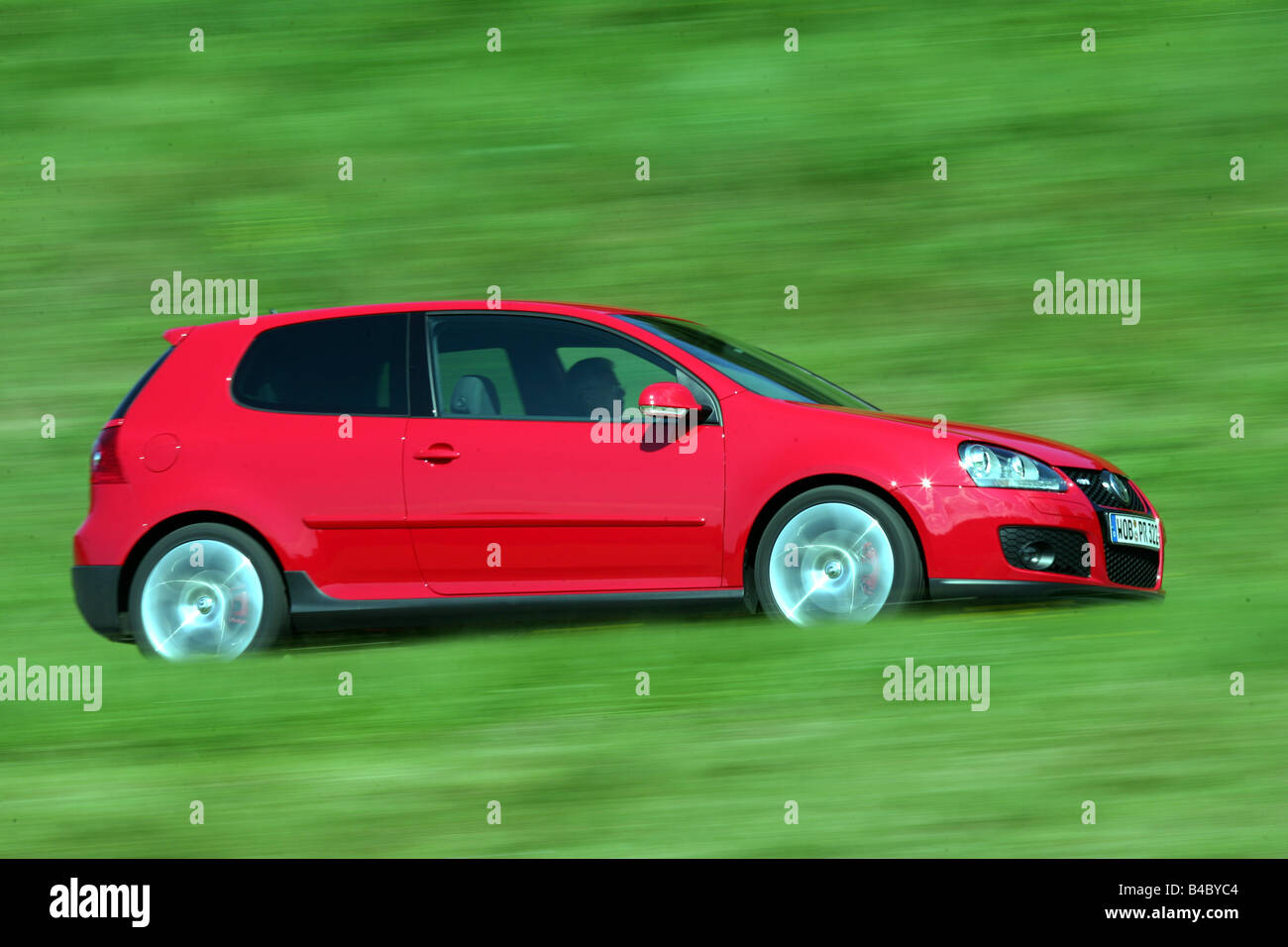 Car, VW Volkswagen Golf GTI, Golf V, model year 2004-, red, Limousine,  Lower middle-sized class, driving, side view, country roa Stock Photo -  Alamy