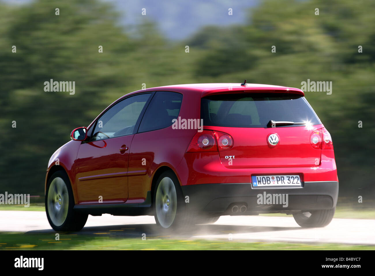 Car, VW Volkswagen Golf GTI, Golf V, model year 2004-, red, Limousine,  Lower middle-sized class, driving, diagonal from the back Stock Photo -  Alamy