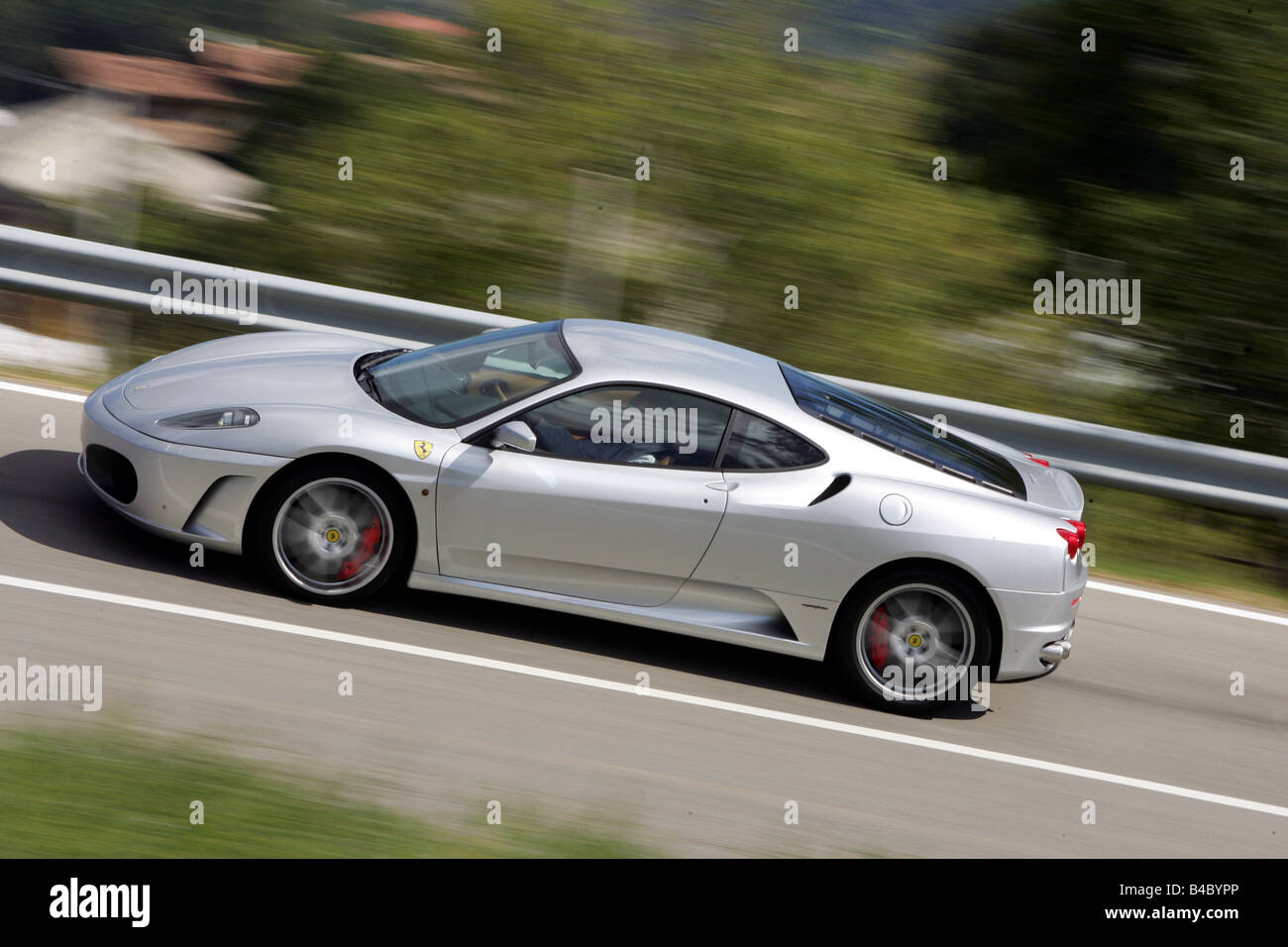 Car, Ferrari F 430, model year 2004-, roadster, coupe/Coupe, silver, driving, side view, country road, photographer: Hans Dieter Stock Photo