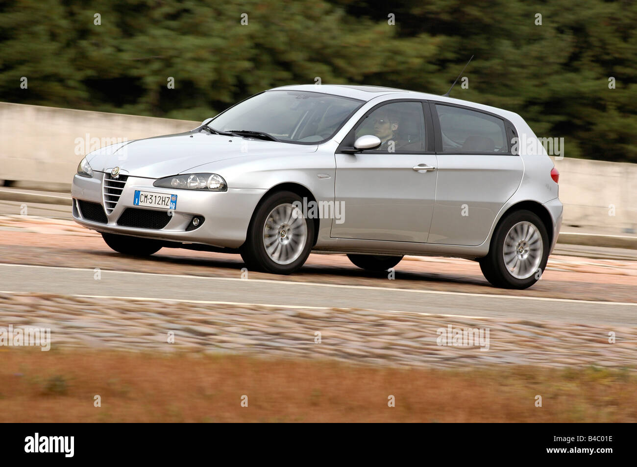 Car, Alfa Romeo 147 1.9 JTD, model year 2004-, silver, Lower middle-sized class, Limousine, driving, diagonal from the front, fr Stock Photo