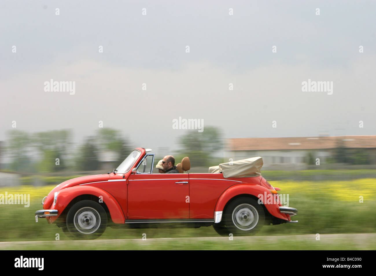 Car, VW Volkswagen Volkswagen beetle convertible, red, Vintage approx., sixties, The 70s, open top, driving, side view, country Stock Photo