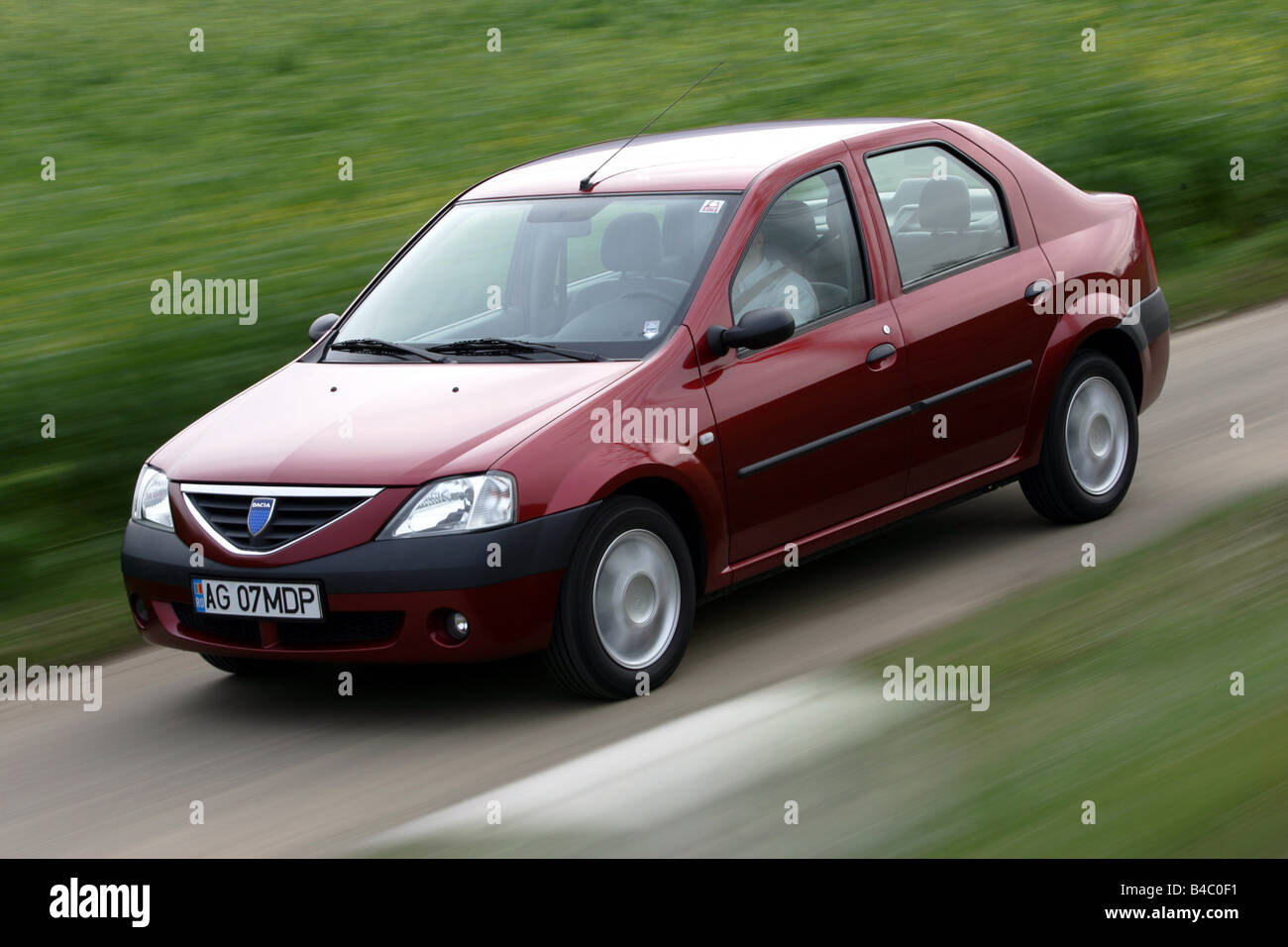 Car, Dacia Logan, model year 2004-, Limousine, Lower middle-sized class, driving, diagonal from front, frontal view, co Stock Photo - Alamy