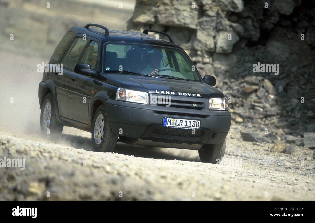 Car, Land Rover Freelander V6, cross country vehicle, model year 2001-, black, driving, offroad, diagonal from the front, Stone, Stock Photo