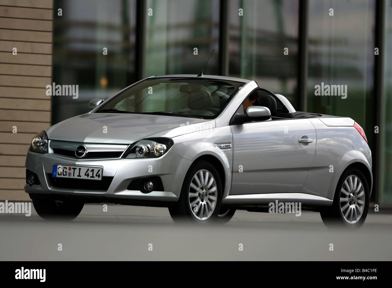 Car, Opel Tigra Twin Top 1.8, Convertible, model year 2004-, silver,  driving, diagonal from the front, frontal view, side view Stock Photo -  Alamy