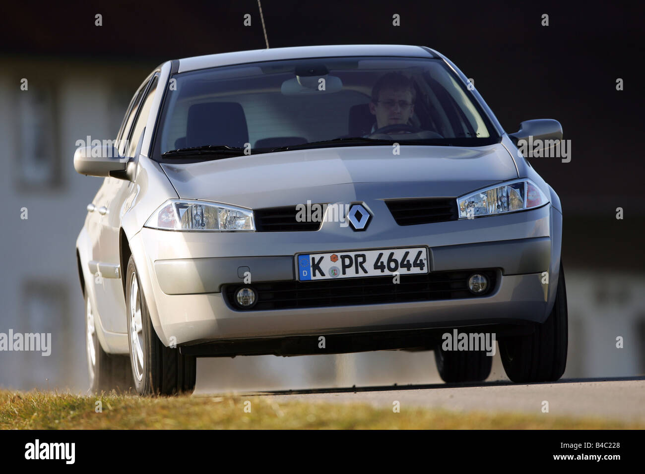 Car, Renault Megane, Mégane, Limousine, model year 2004-, Lower  middle-sized class, silver, driving, diagonal from the front, fr Stock  Photo - Alamy