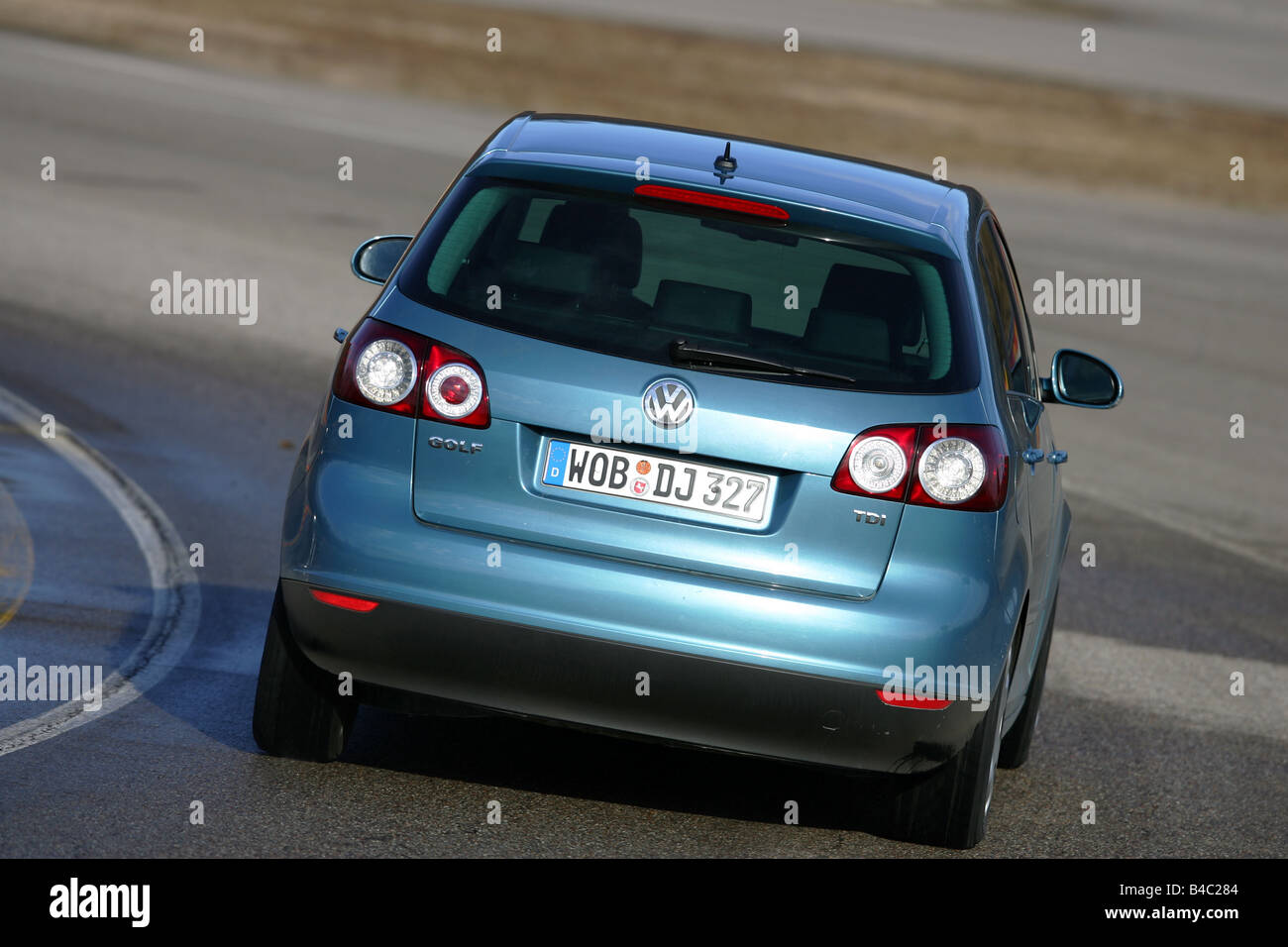 Car, VW Volkswagen Golf Plus 1.9 TDI, model year 2004-, blue, Lower  middle-sized class, Limousine, driving, diagonal from the ba Stock Photo -  Alamy