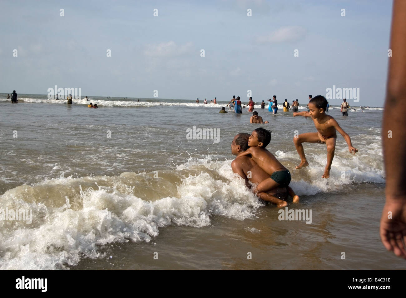 Two boys are enjoying bath at the beach of Digha, West Bengal,India ...