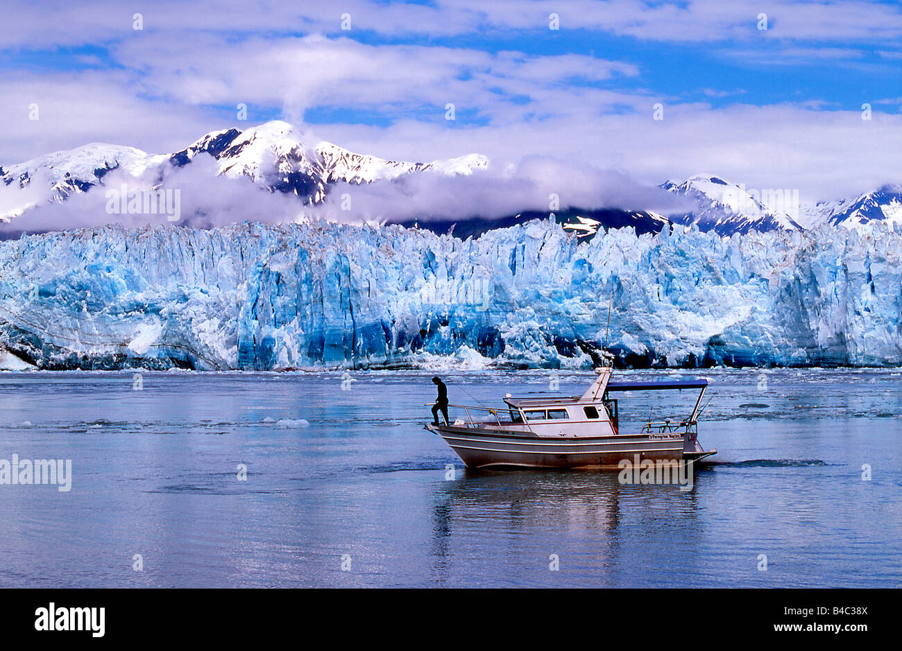 Small tour boat is ideal for close up views of Hubbard Tidewater Glacier Tongass National Forest near Yakutat Alaska Stock Photo