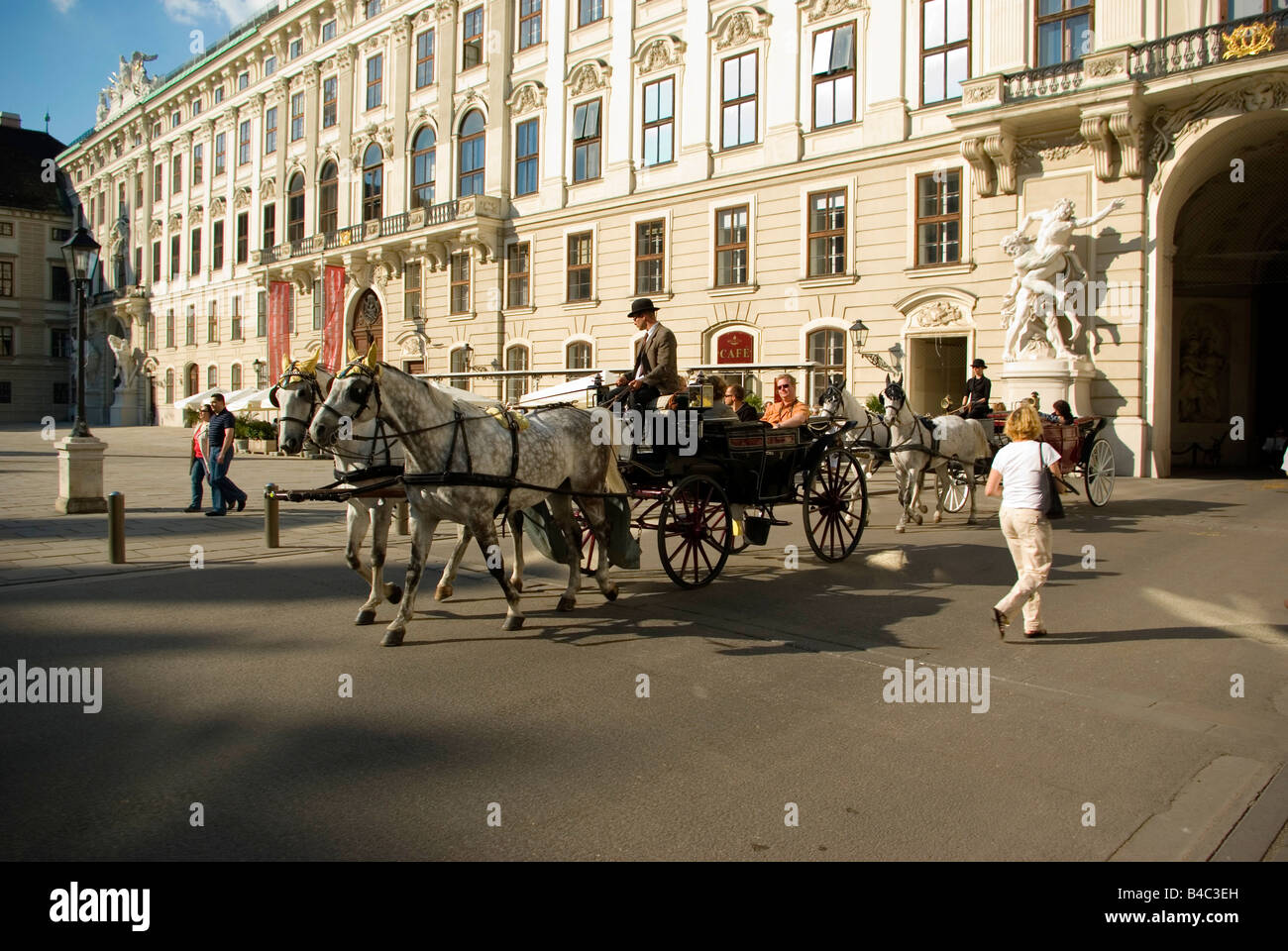 Carriage with tourists in Hofburg Palace in Vienna Austria Stock Photo