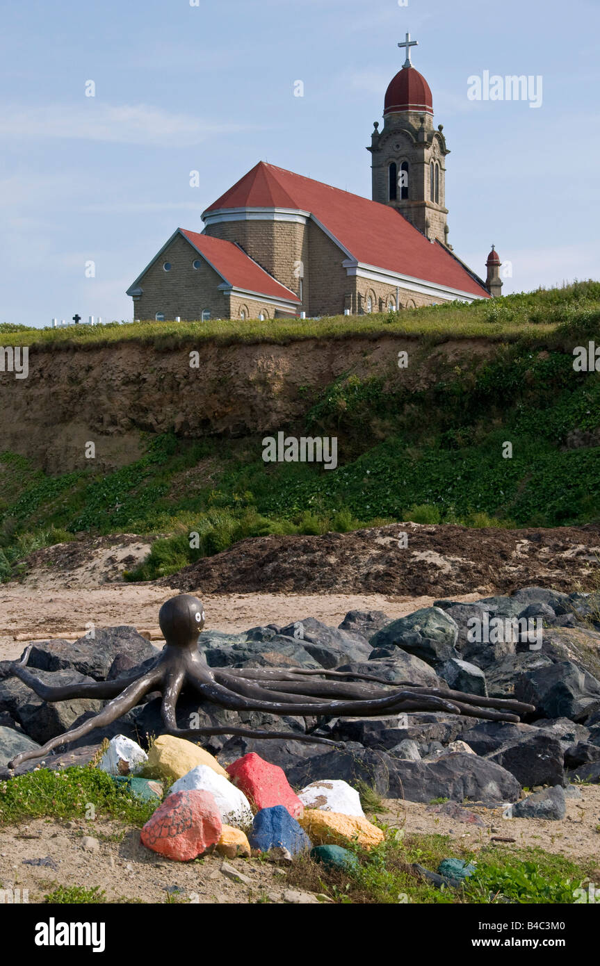 Sculpture and church St Simon & St Jude in Grande Anse New Brunswick Canada Stock Photo