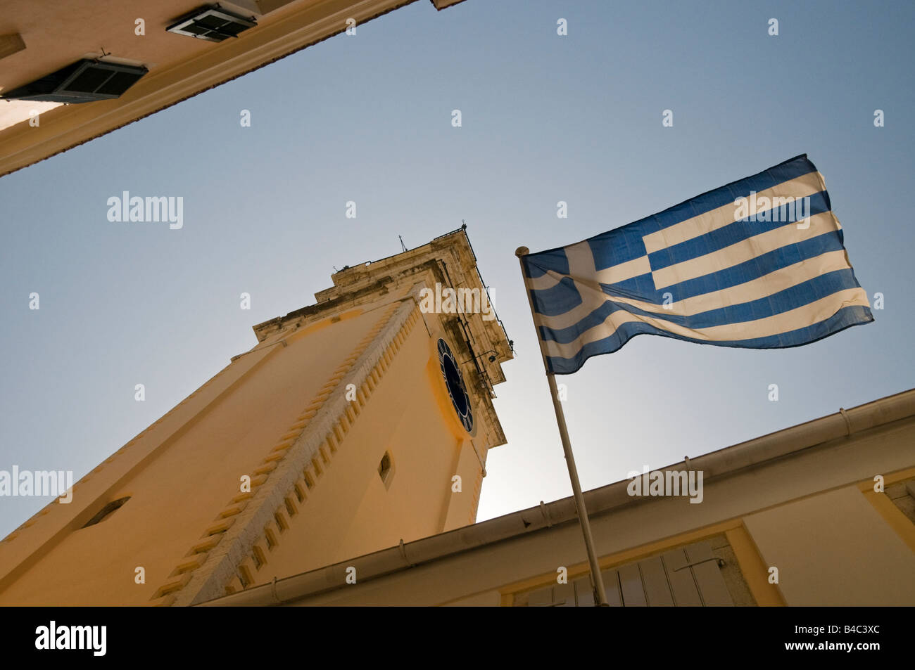 Greek Flag Flying Below Saint Spiridon's Church Tower in Corfu Town, Corfu, Greece, Europe Stock Photo