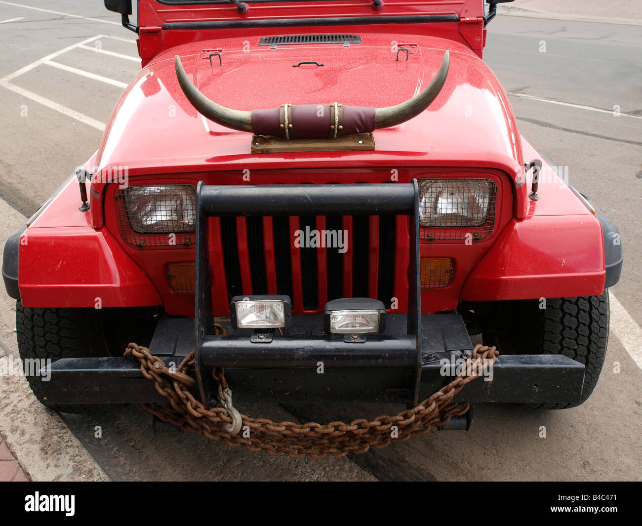 Jeep with cattle horns on the hood Stock Photo