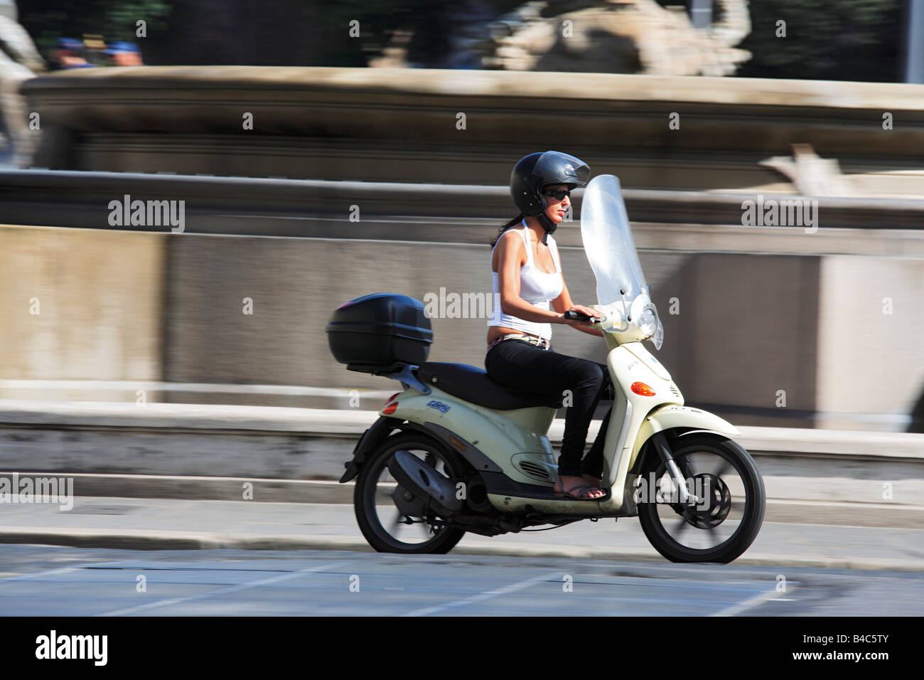 Woman driving a scooter Rome Italy Stock Photo - Alamy