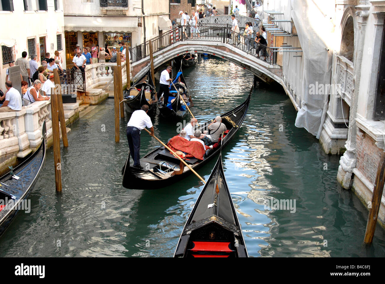 Gondolas and tourists Venice Stock Photo