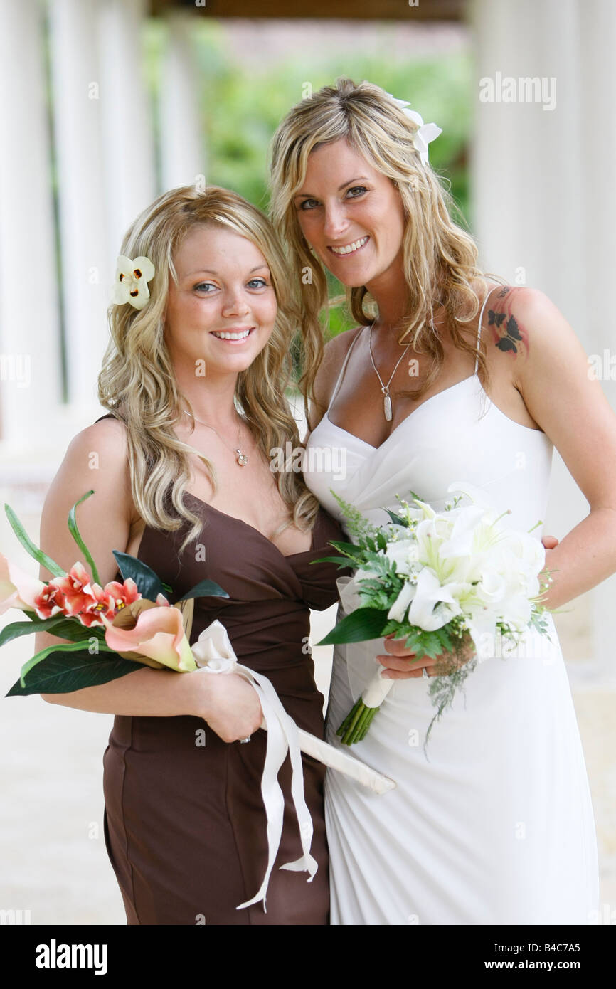 bride and sister posing for a photo Stock Photo