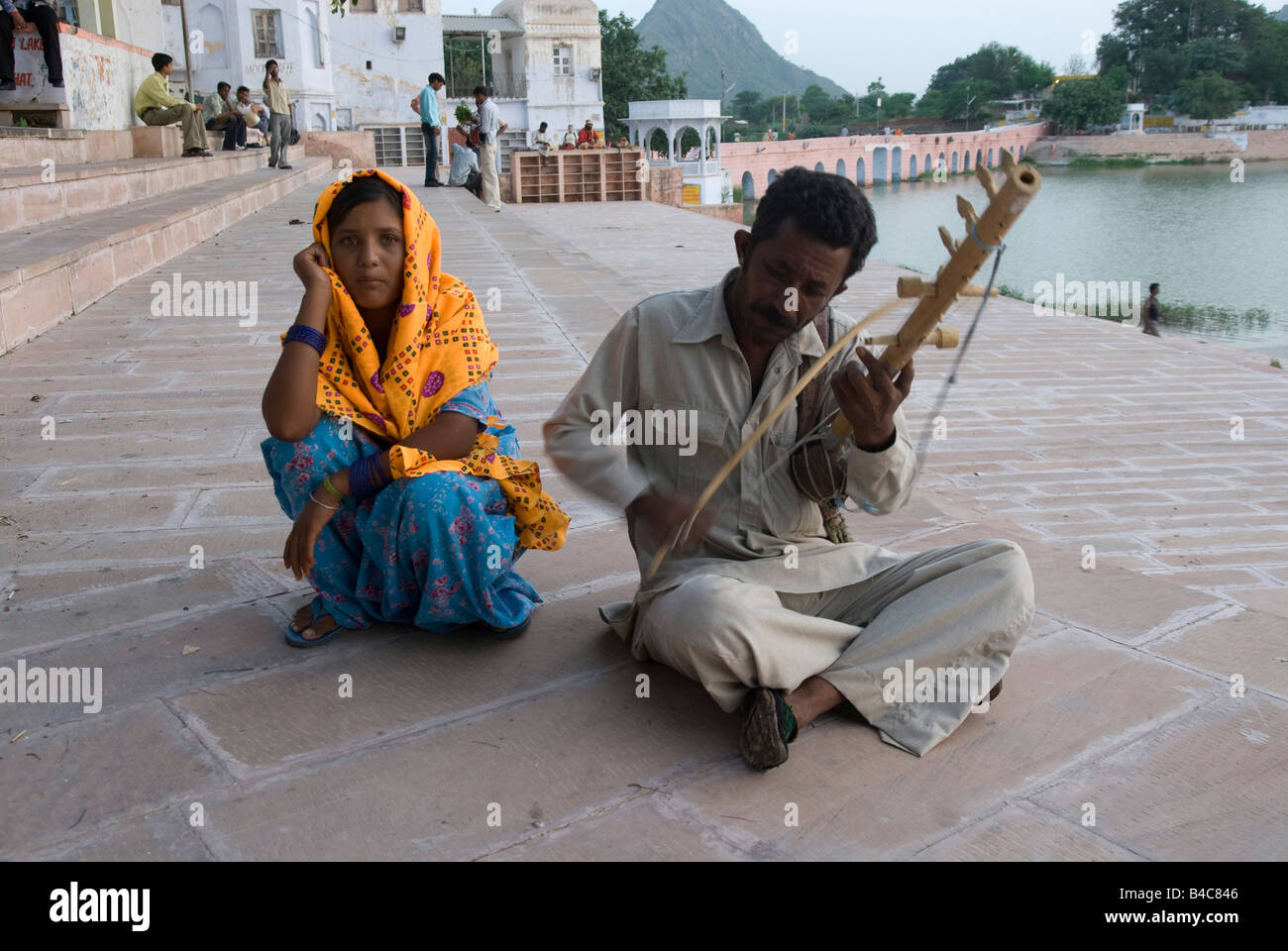 India Rajasthan Pushkar Playing music on the shore of the lake Stock Photo
