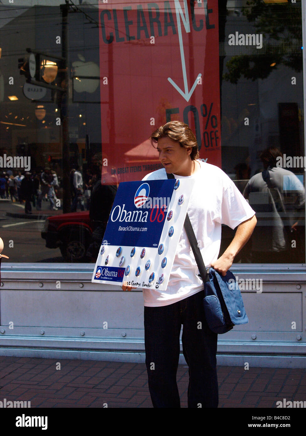 Barack Obama supporter campaigning and fund raising by selling buttons Market Street San Francisco California USA Stock Photo