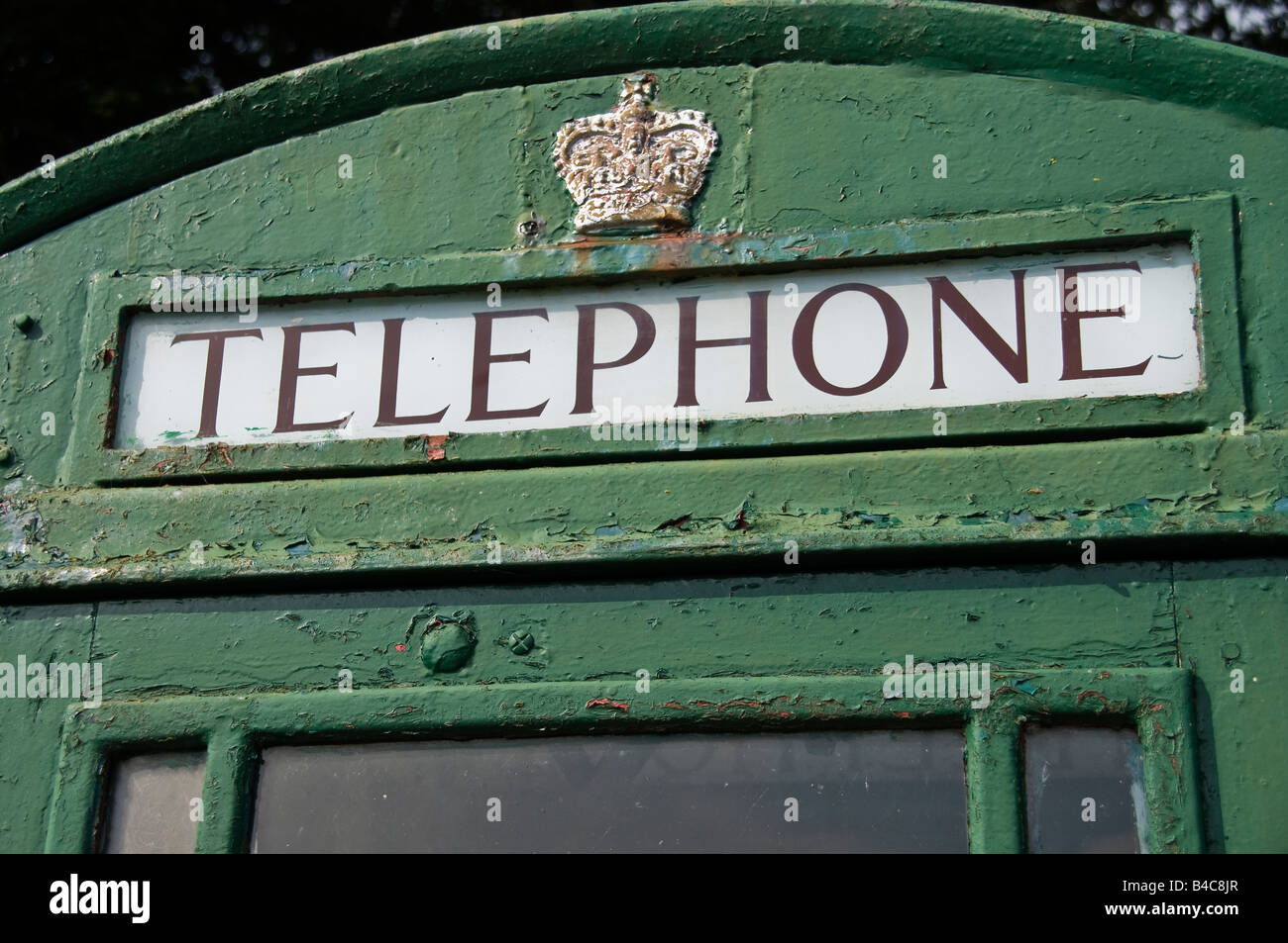 Telephone box which has been painted green, traditionally done in Ireland. Stock Photo