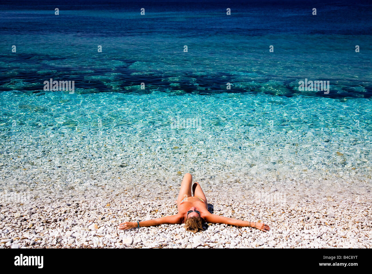 Nude Girl Sun Tanning On Beach