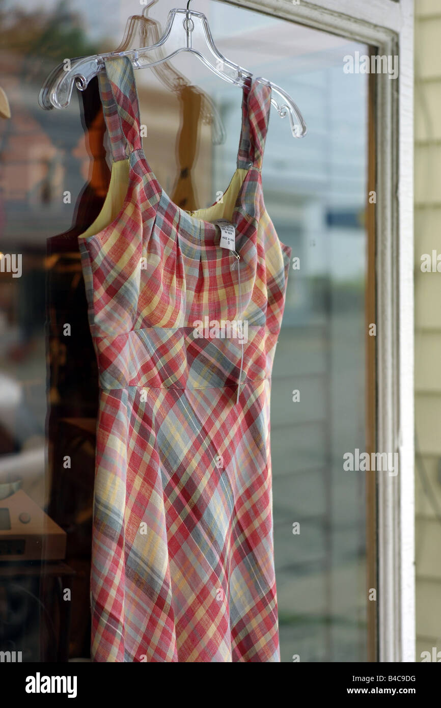 A plaid summer dress made in china hanging outside a shop in Valatia upstate New York USA Stock Photo