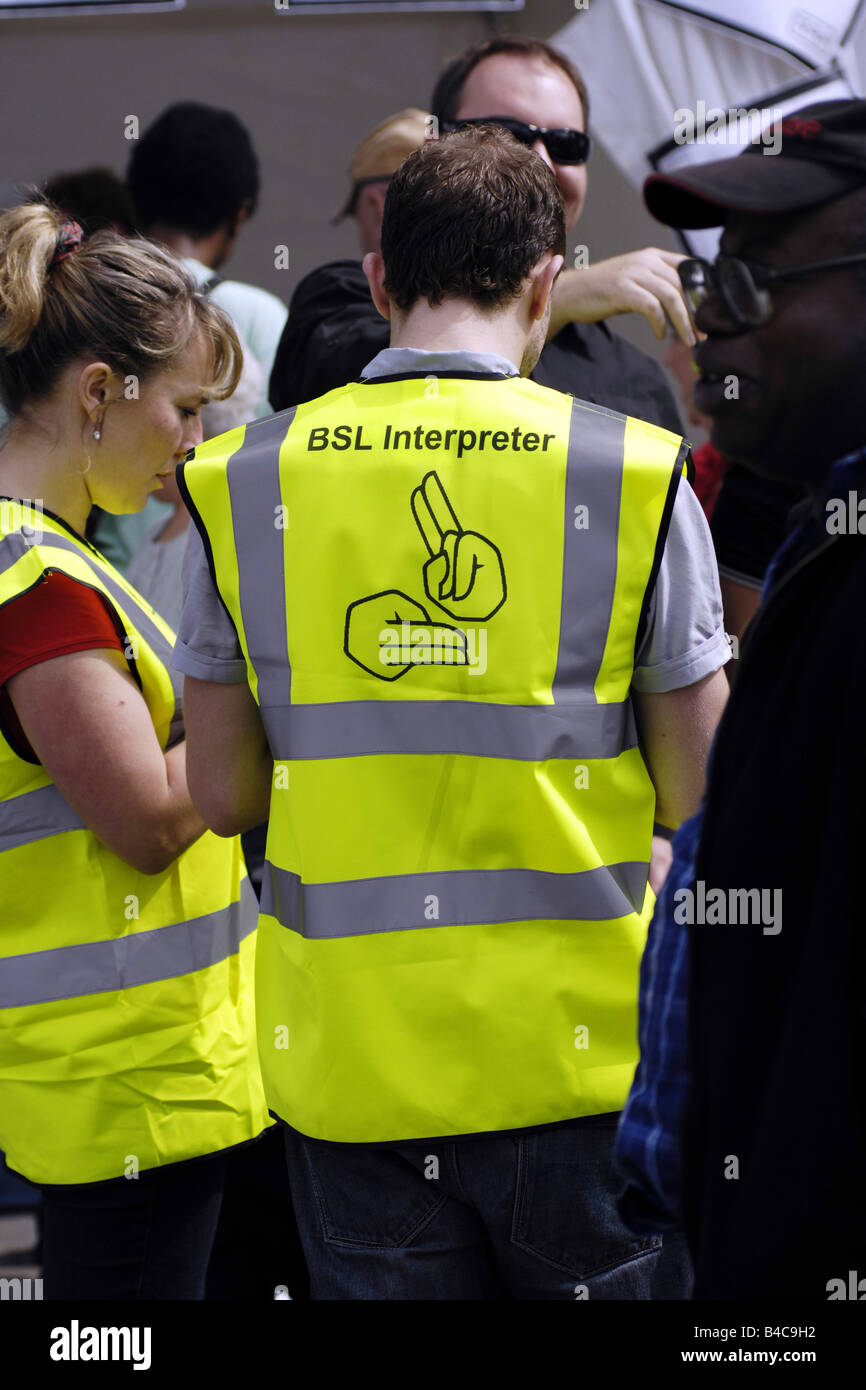 Deaf Sign language Interpreters wearing yellow jackets at the Liberty Festival London Stock Photo