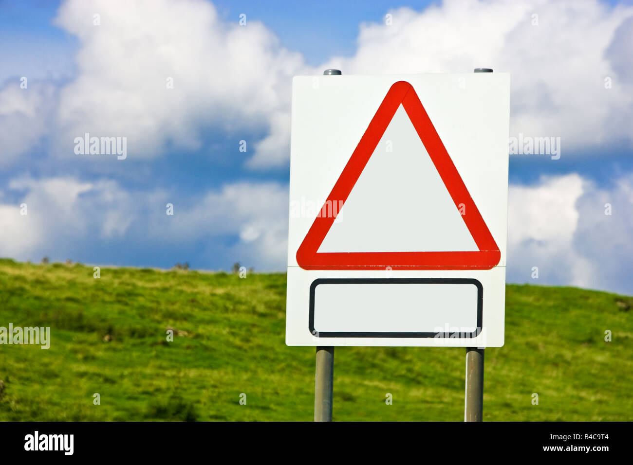 Blank red triangle road warning sign England UK Stock Photo
