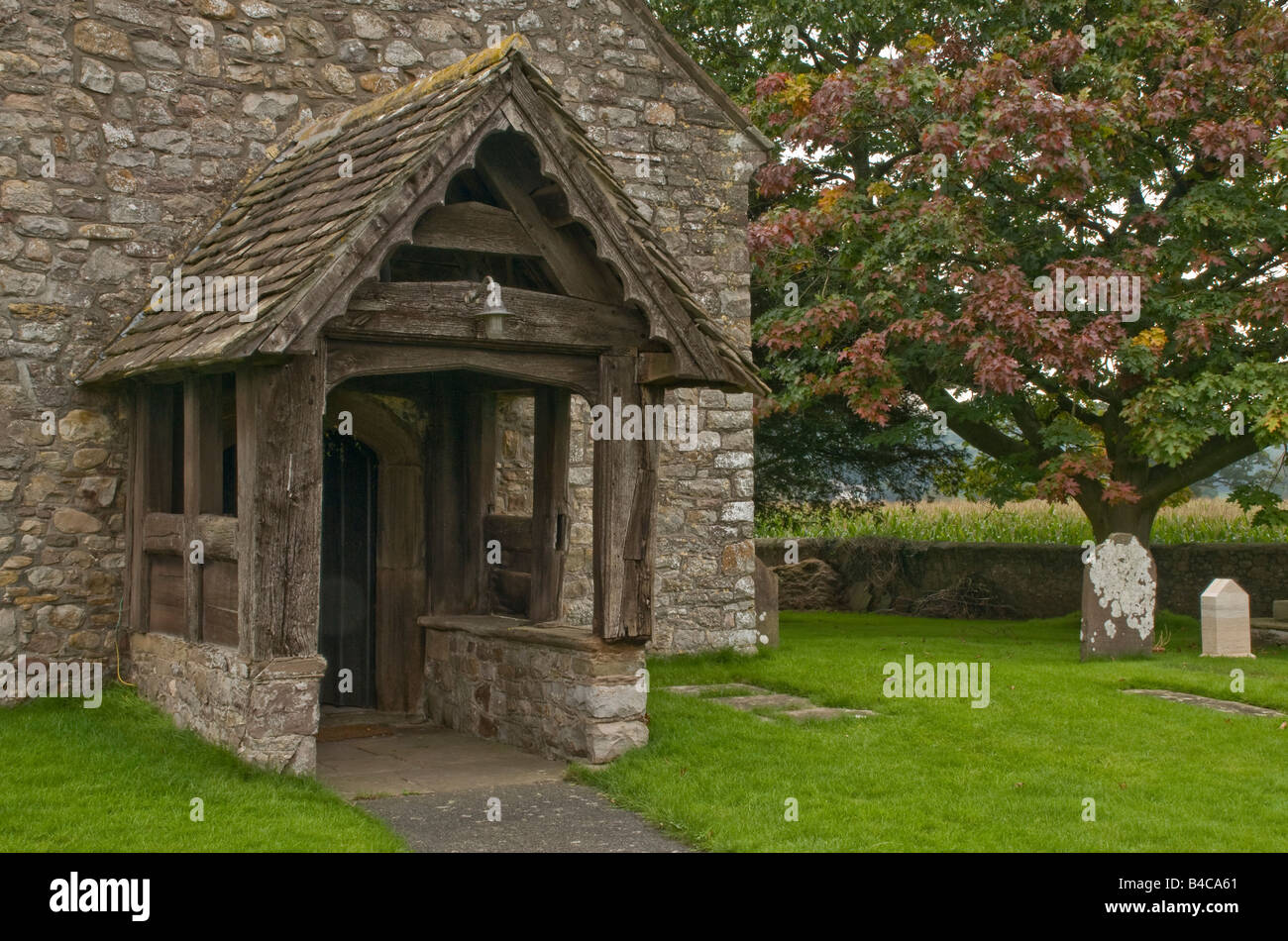 Wooden church porch at the church of All Saints at Kemeys Commander in Monmouthshire Stock Photo