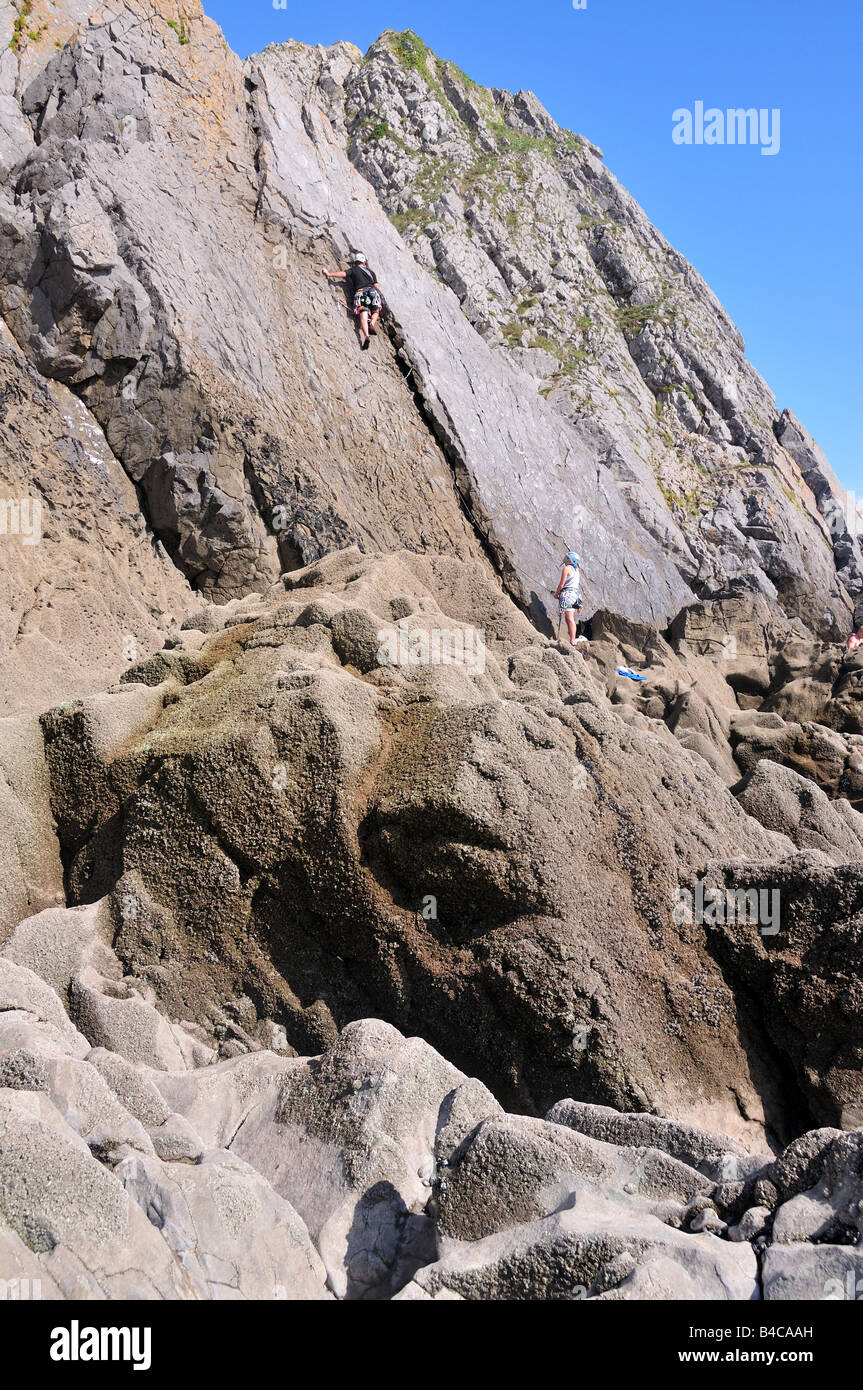 Rock climbing at Three Cliffs Bay Gower Peninsular Wales