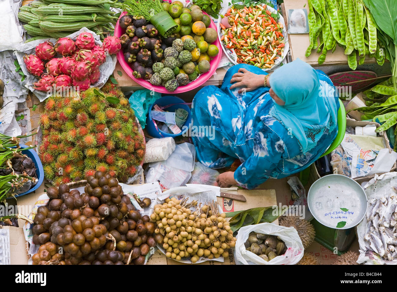 Asia, Malaysia, Kelantan State, Kota Bharu, Woman selling fruit and