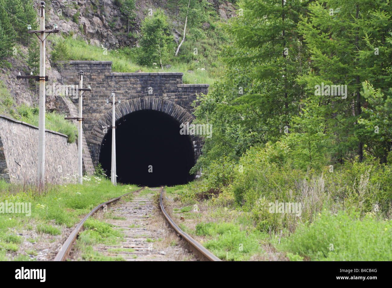 Entrance to the old railroad tunnel Stock Photo