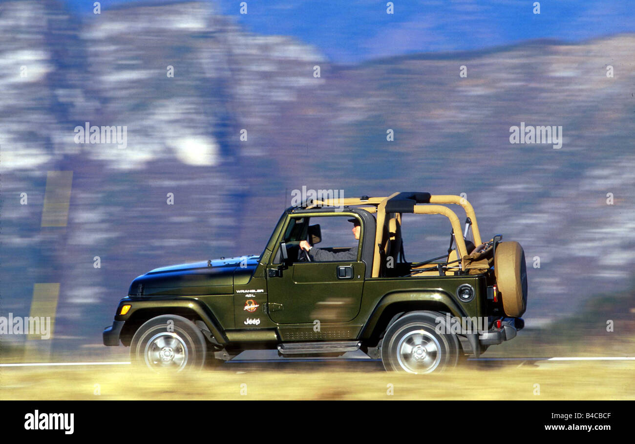 Car, Chrysler Jeep Wrangler , cross country vehicle, model year 1996-,  green/brown, driving, offroad, side view Stock Photo - Alamy