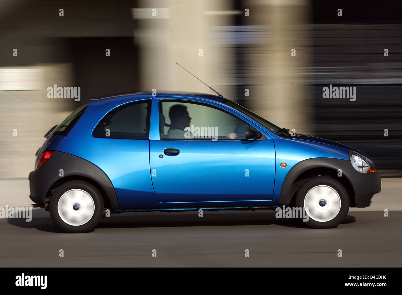 Car, Ford KA Student, model year 2004-, blue, Limousine, Miniapprox.s, driving, side view, City, photographer: Achim Hartmann Stock Photo