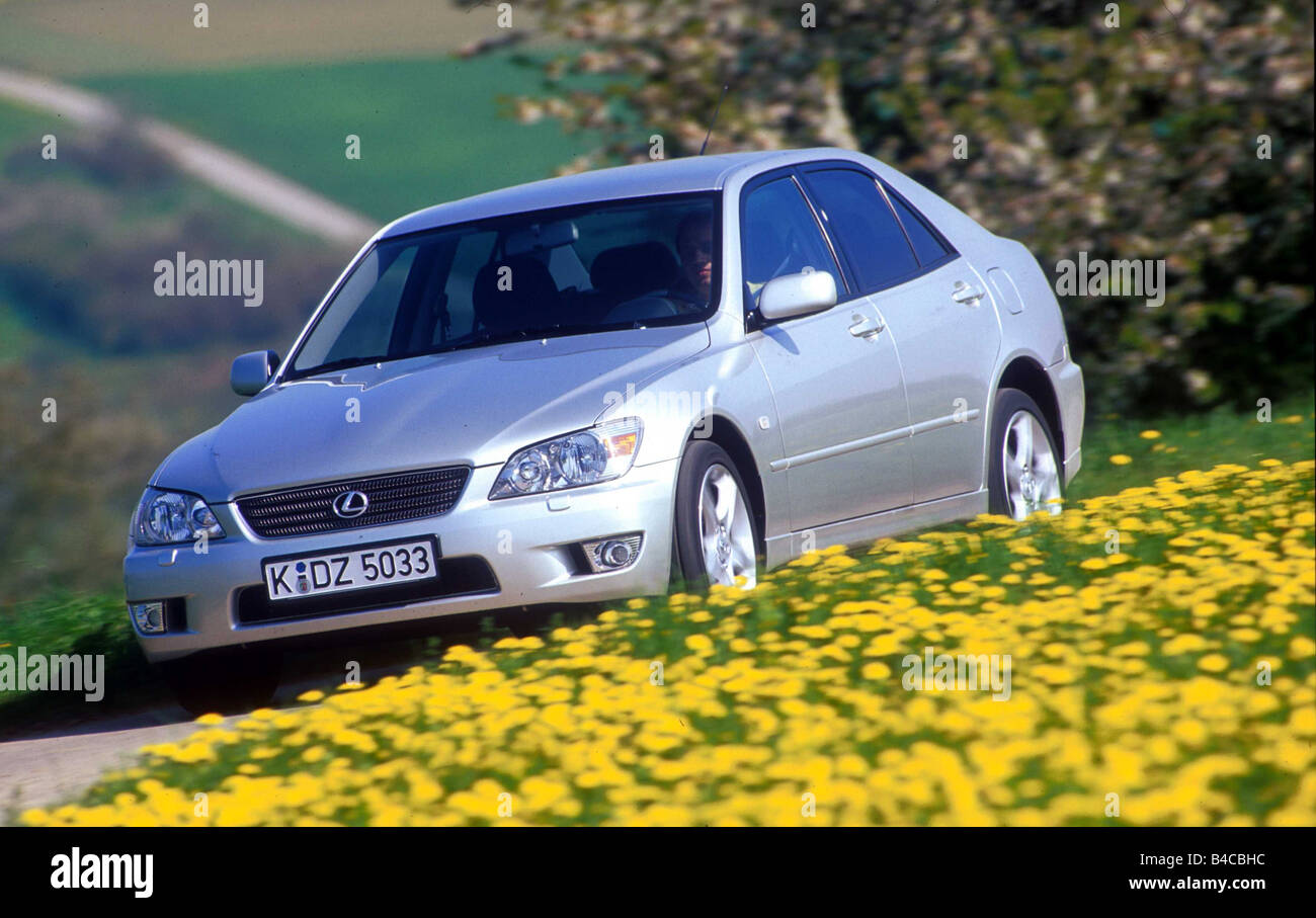 Car, Lexus IS 200 Sport, Limousine, medium class, model year 1999-, silver, country road, driving, diagonal from the front Stock Photo