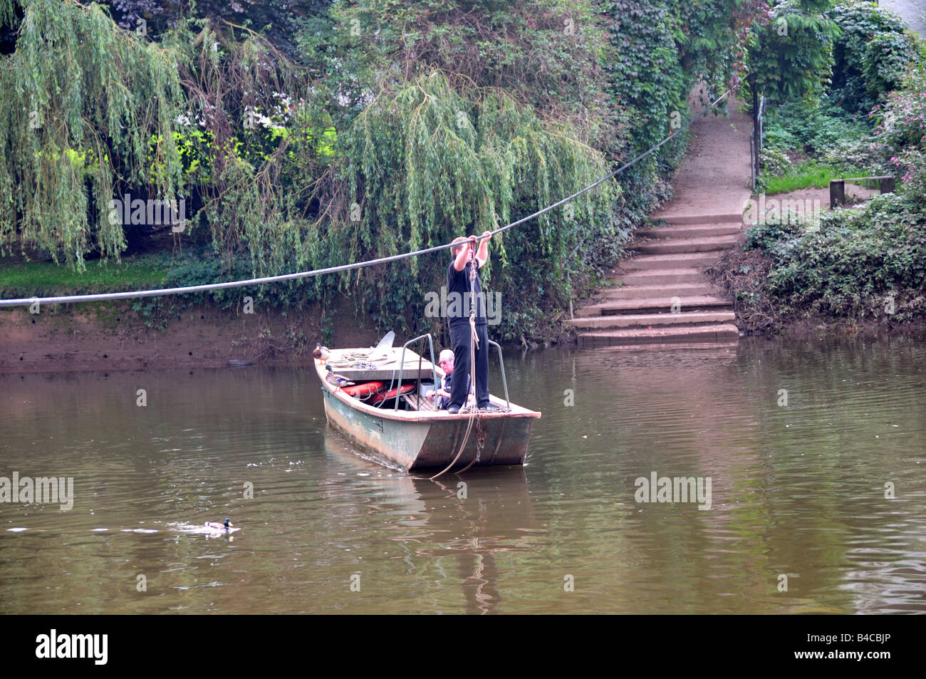 Hand pulled rope ferry across Wye river Symonds Yat Herefordshire England Stock Photo