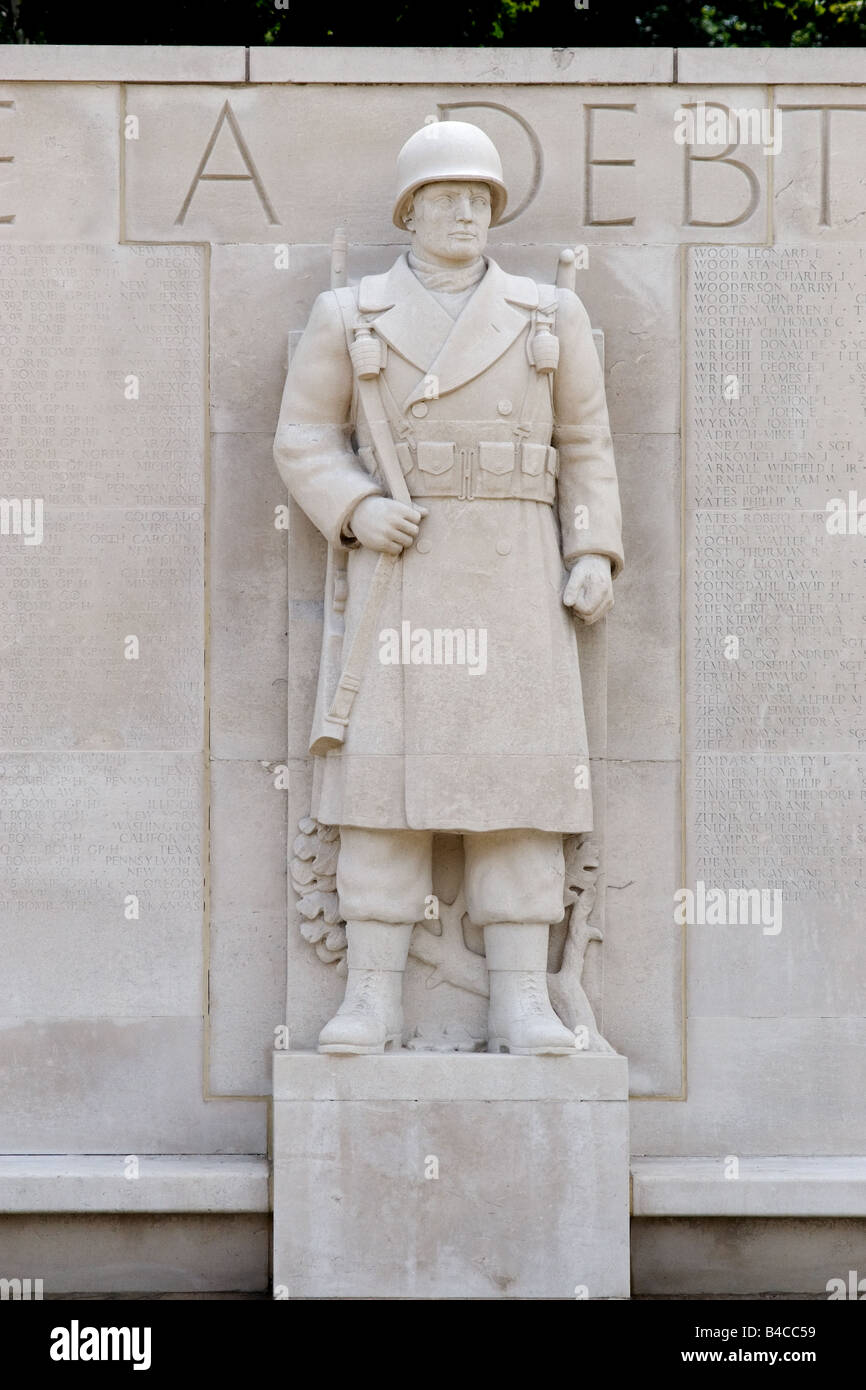 stone wall and carved soldier the American Cemetery Memorial grounds war museum nr Madingley Cambridge Stock Photo