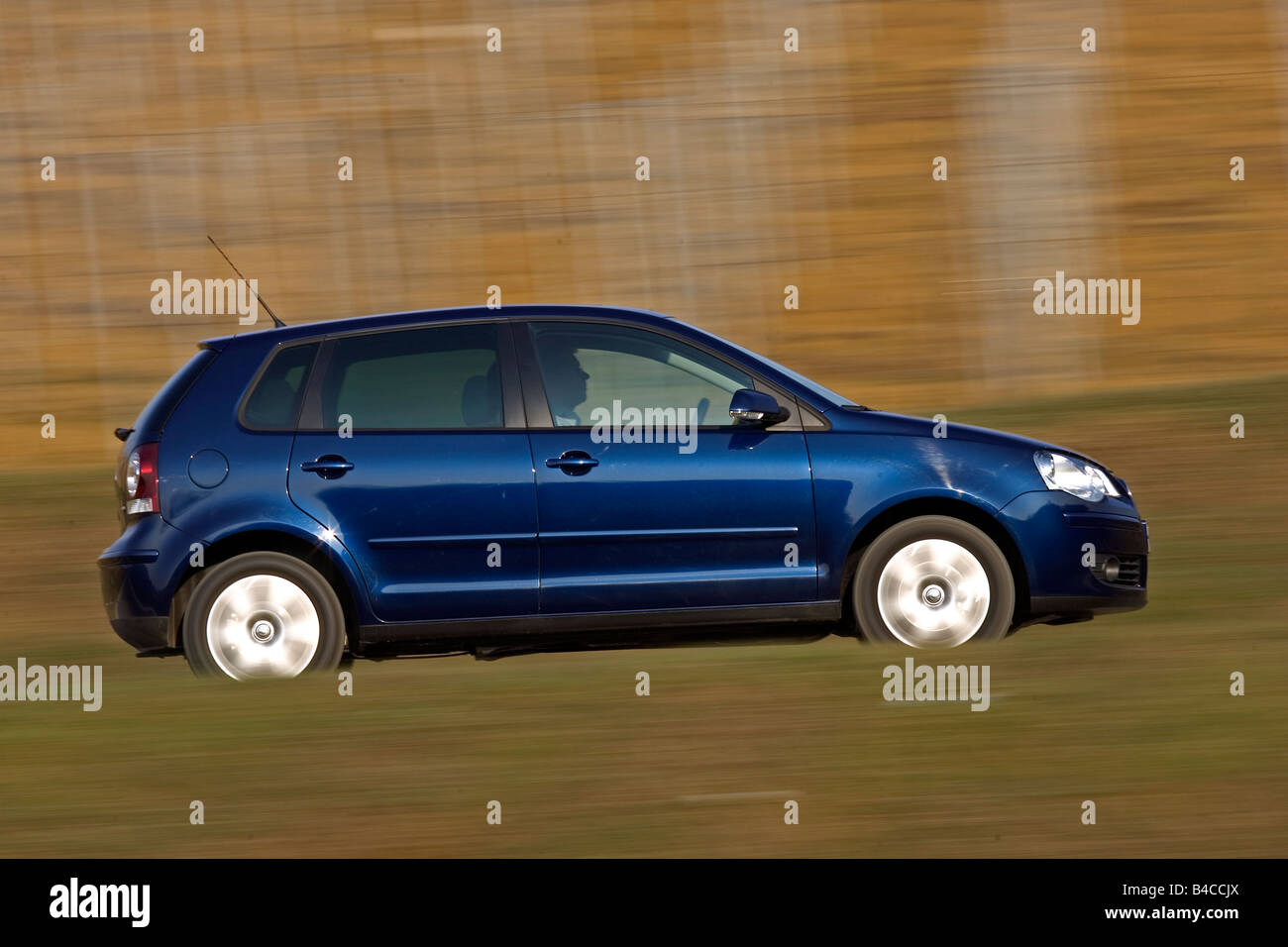 Car, VW Volkswagen Polo 1.9 TDI, model year 2005-, dark blue, small  approx., Limousine, driving, side view, country road, photog Stock Photo -  Alamy