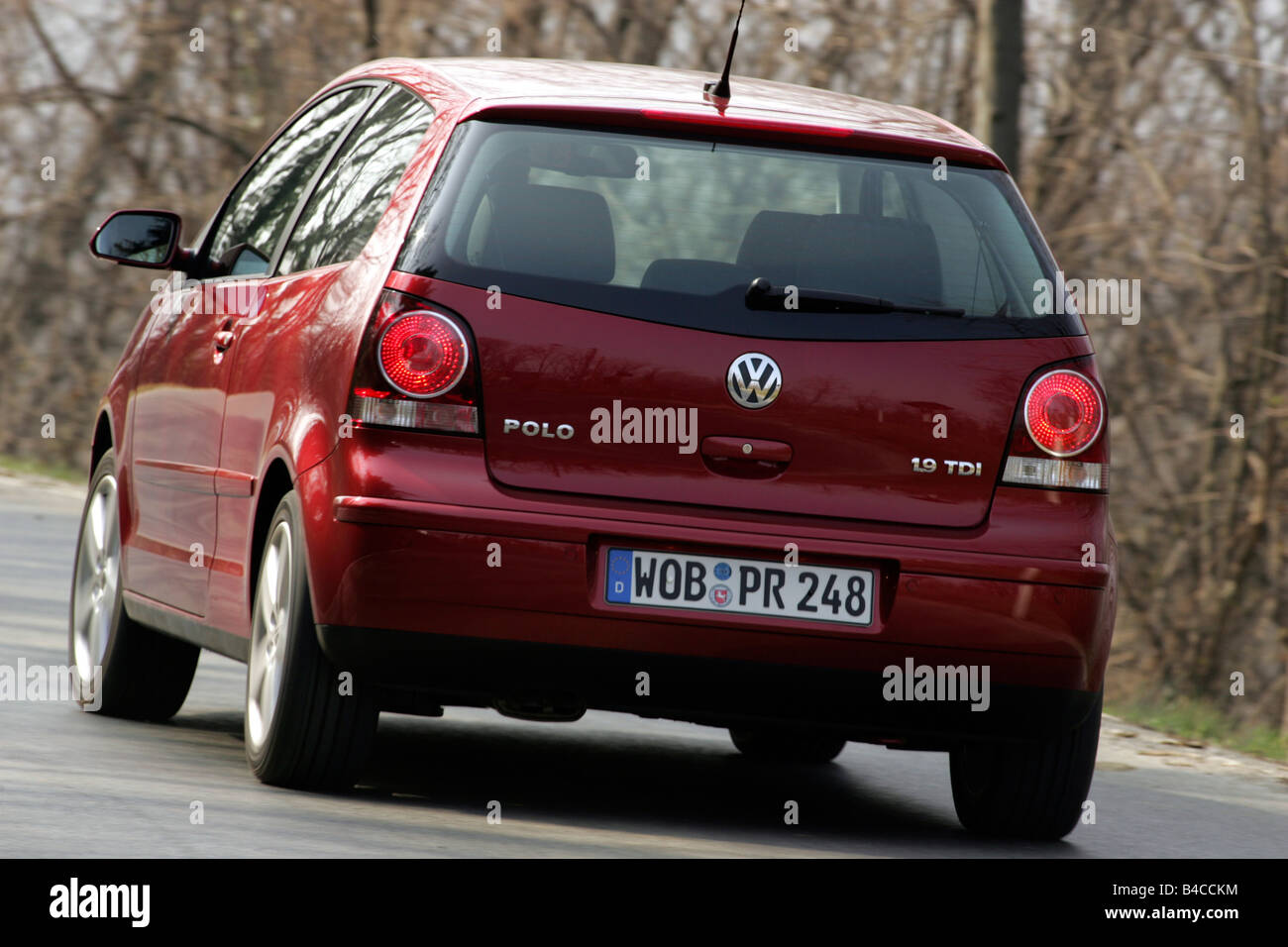 Car, VW Volkswagen Polo 1.4 TDI, model year 2005-, ruby colored, small  approx., Limousine, driving, diagonal from the back, rear Stock Photo -  Alamy