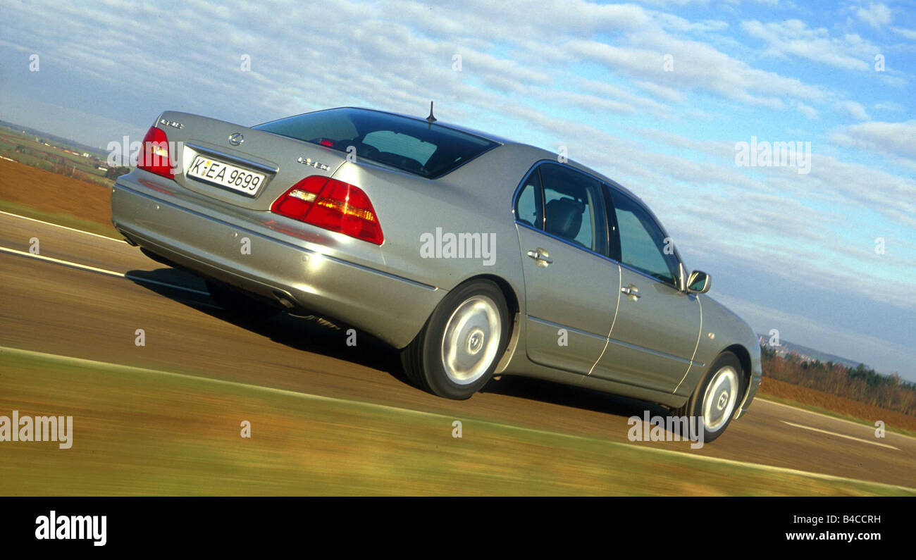 Car, Lexus LS 430, Limousine, Luxury approx.s, model year 2001-, silver, driving, country road, diagonal from the back, Rear vie Stock Photo