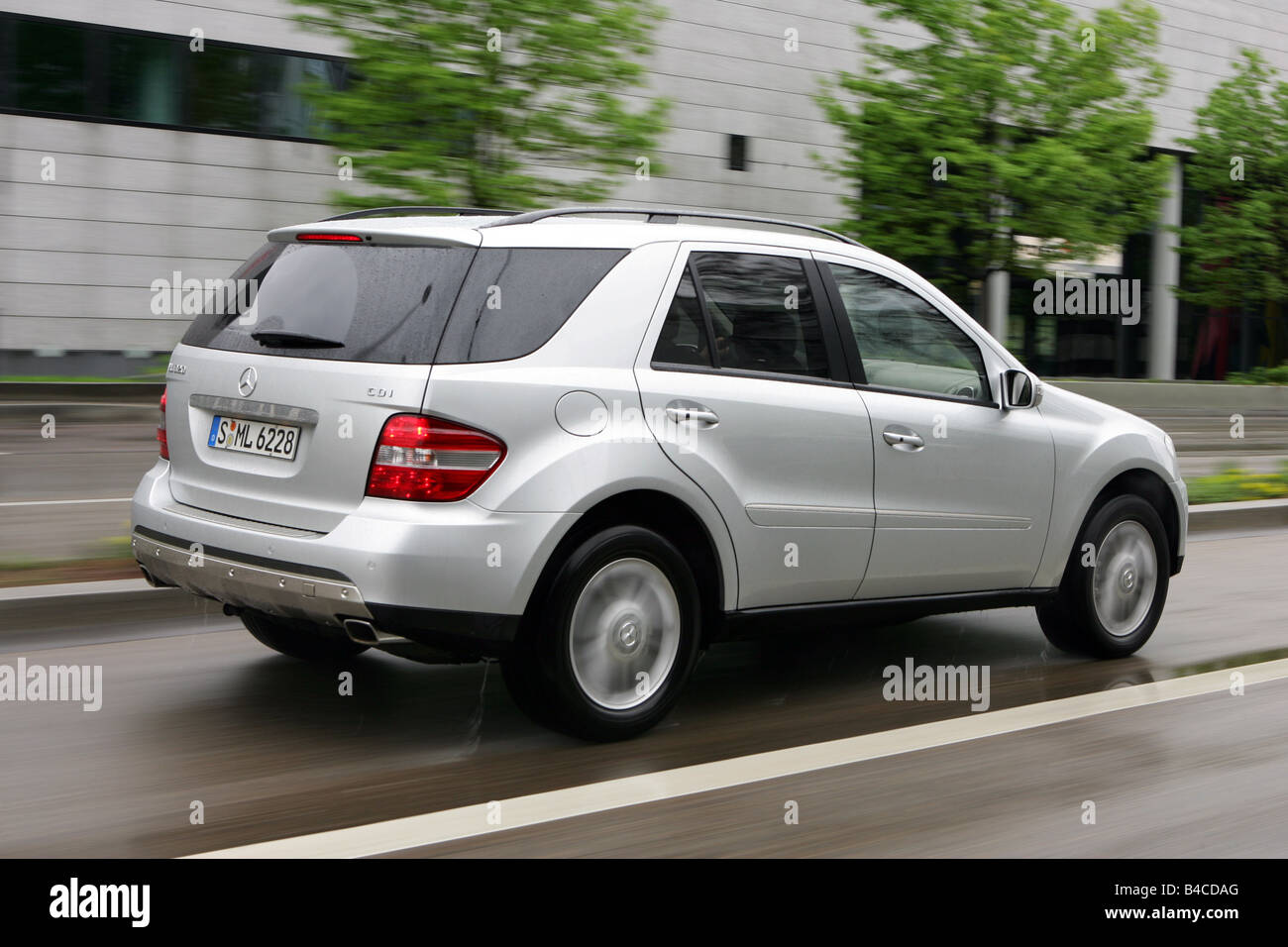 Car, Mercedes ML 320 CDI, model year 2005-, silver, cross country vehicle,  driving, diagonal from the back, rear view, side view Stock Photo - Alamy