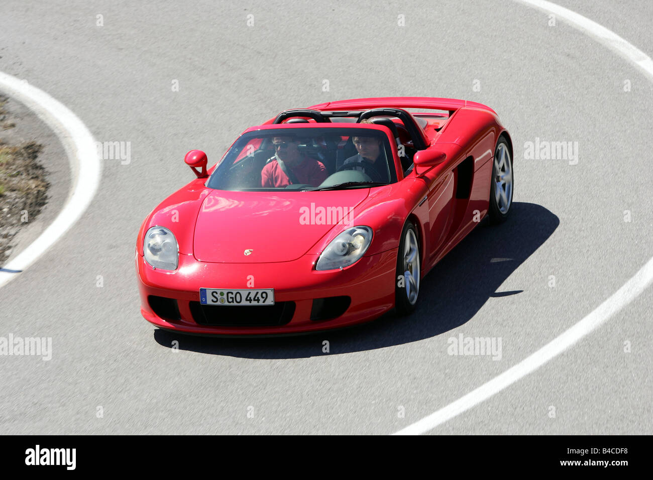 Car, Porsche Carrera GT, model year 2005-, red, Convertible, open top,  driving, diagonal from the front, frontal view, country r Stock Photo -  Alamy