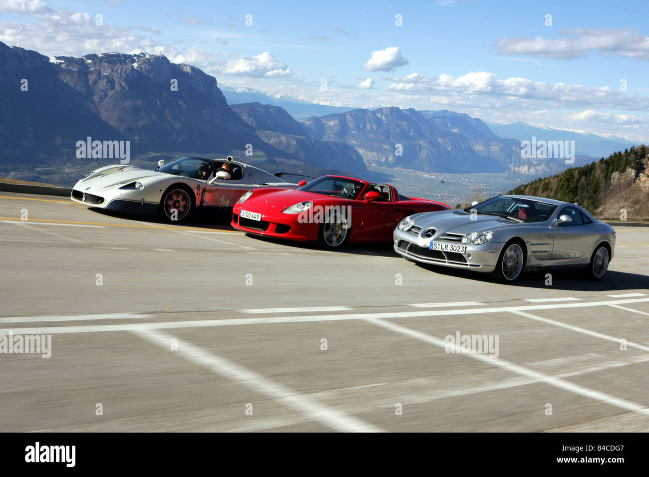 Car, Porsche Carrera GT, Maserati MC 12, Mercedes SLR, model year 2005-,  roadsters, driving, diagonal from the front, frontal vi Stock Photo - Alamy