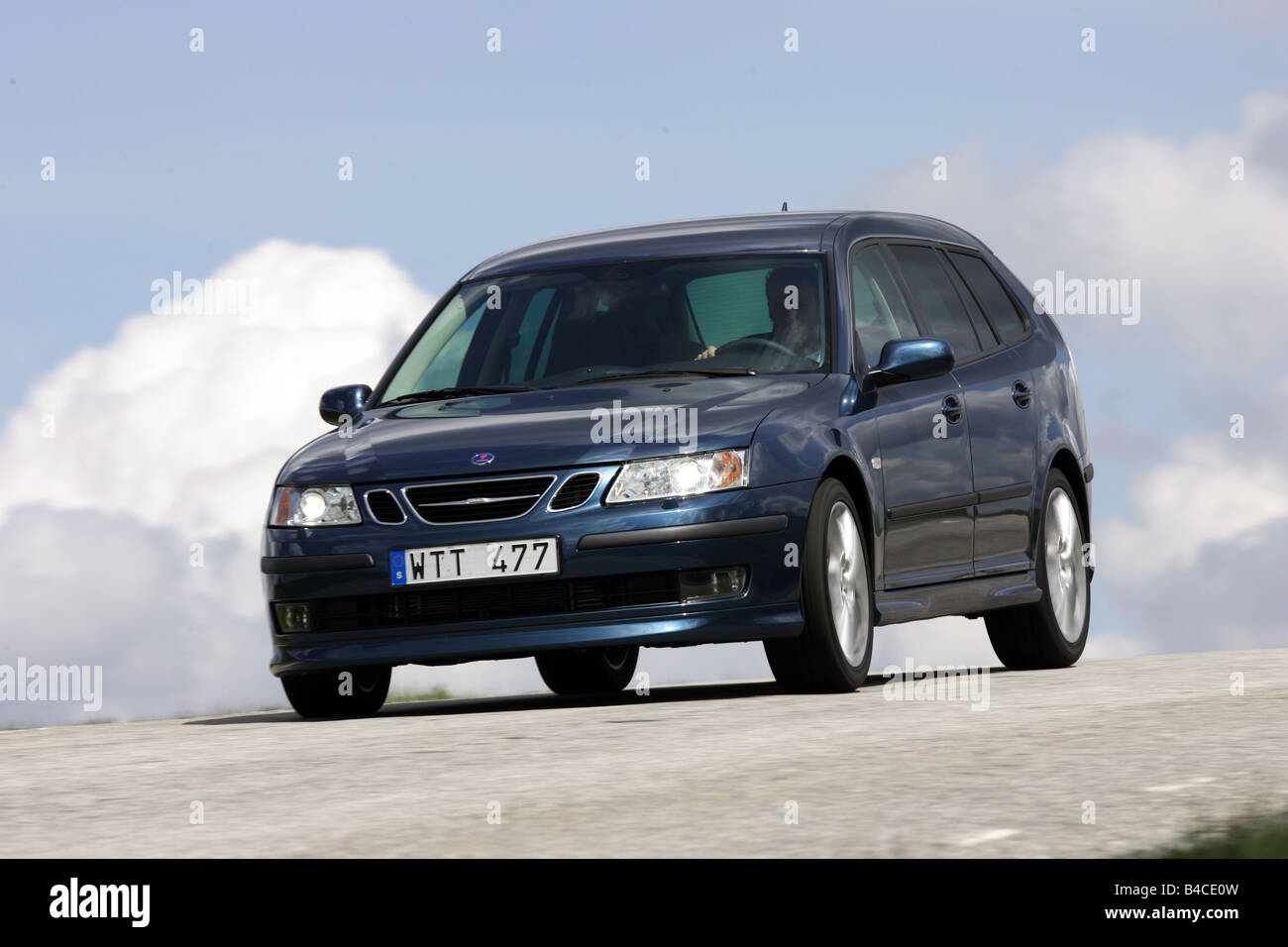Car, Saab 9-3 Sport Combi 2.8 V6, model year 2005-, dark blue, Break combination, driving, diagonal from the front, frontal view Stock Photo